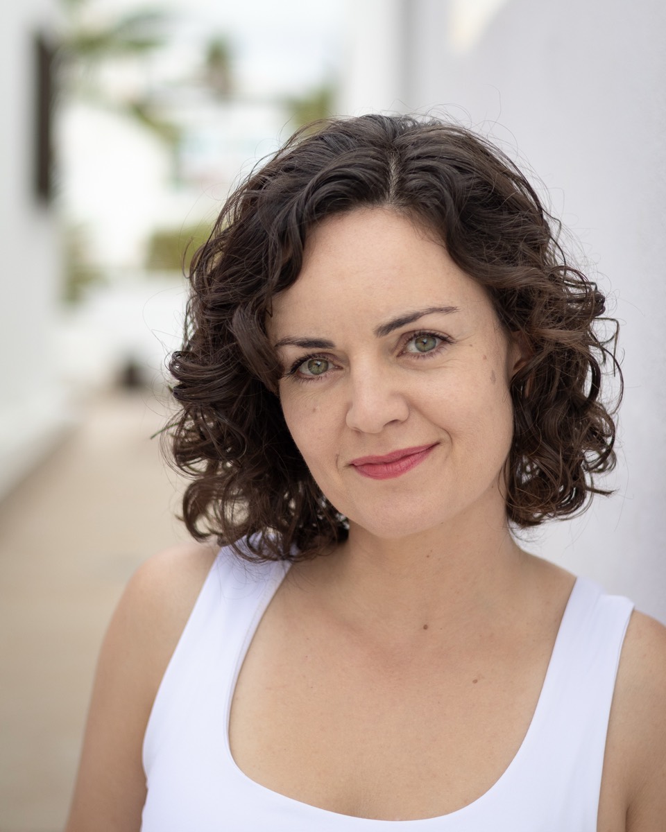 Headshot of Ainhoa Barrio facing the camera, white top